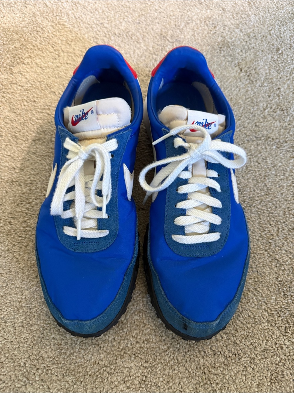 Nike Blue Retro Running Sneakers with White Swoosh and Red Heel Accent